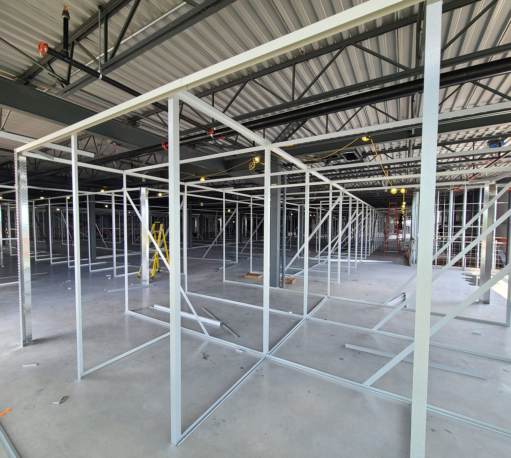 Self-storage facility under construction with steel framing and partitions being installed